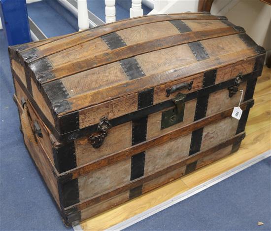 A leather and oak dome top trunk, W.88cm